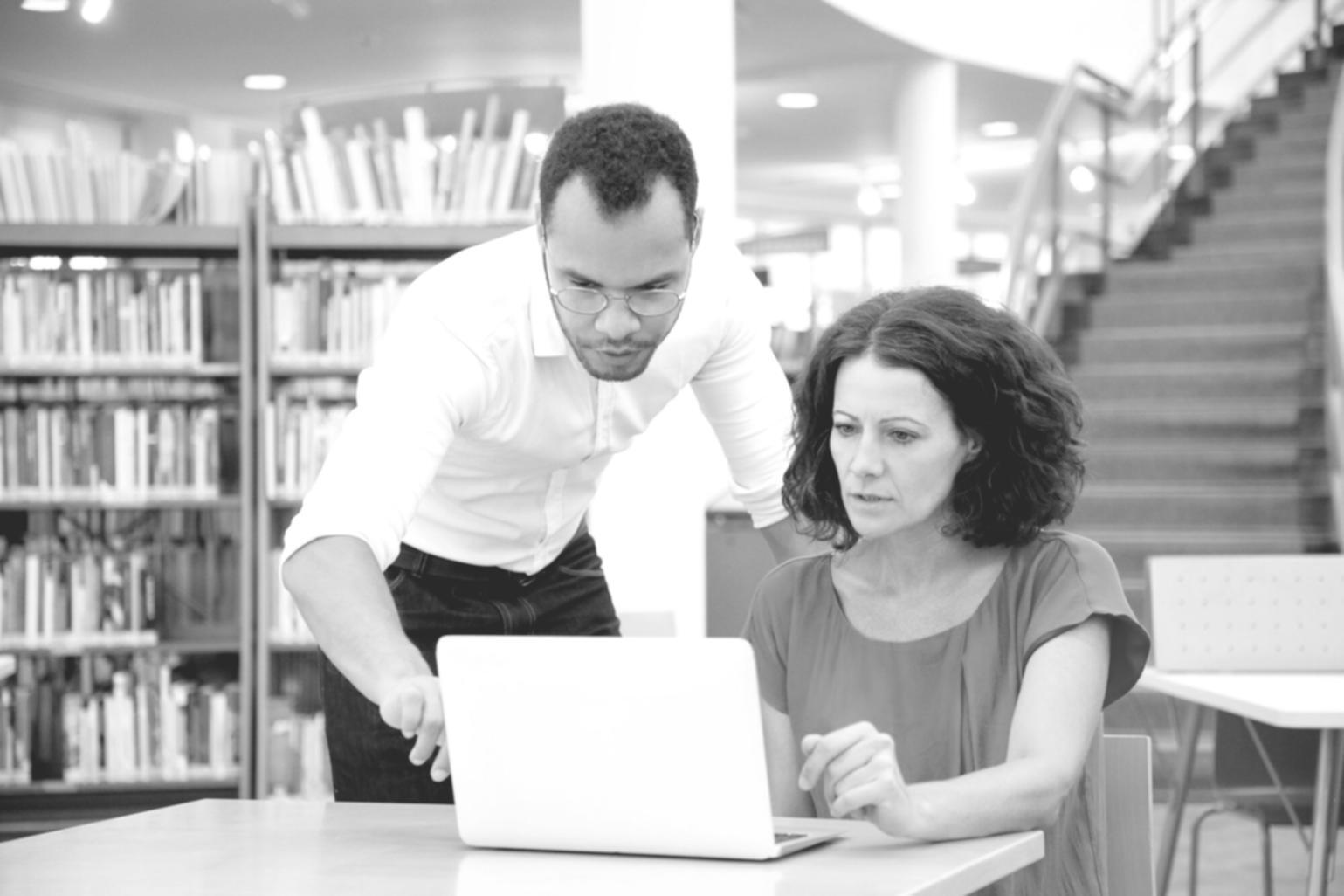 Students analyzing financial statements during practical workshop session