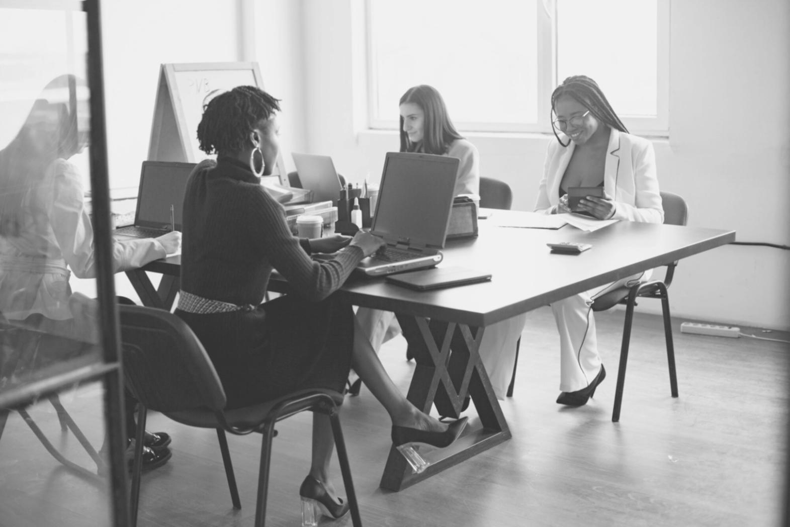 Professional consultation setting showing investment analysis materials and educational resources