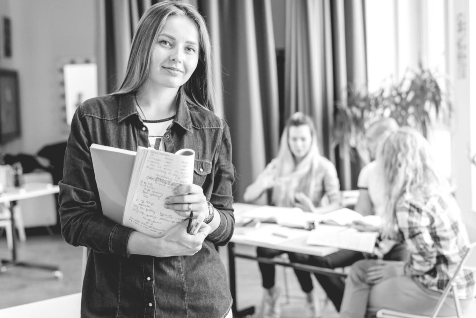 Students reviewing financial charts and documents during analysis workshop