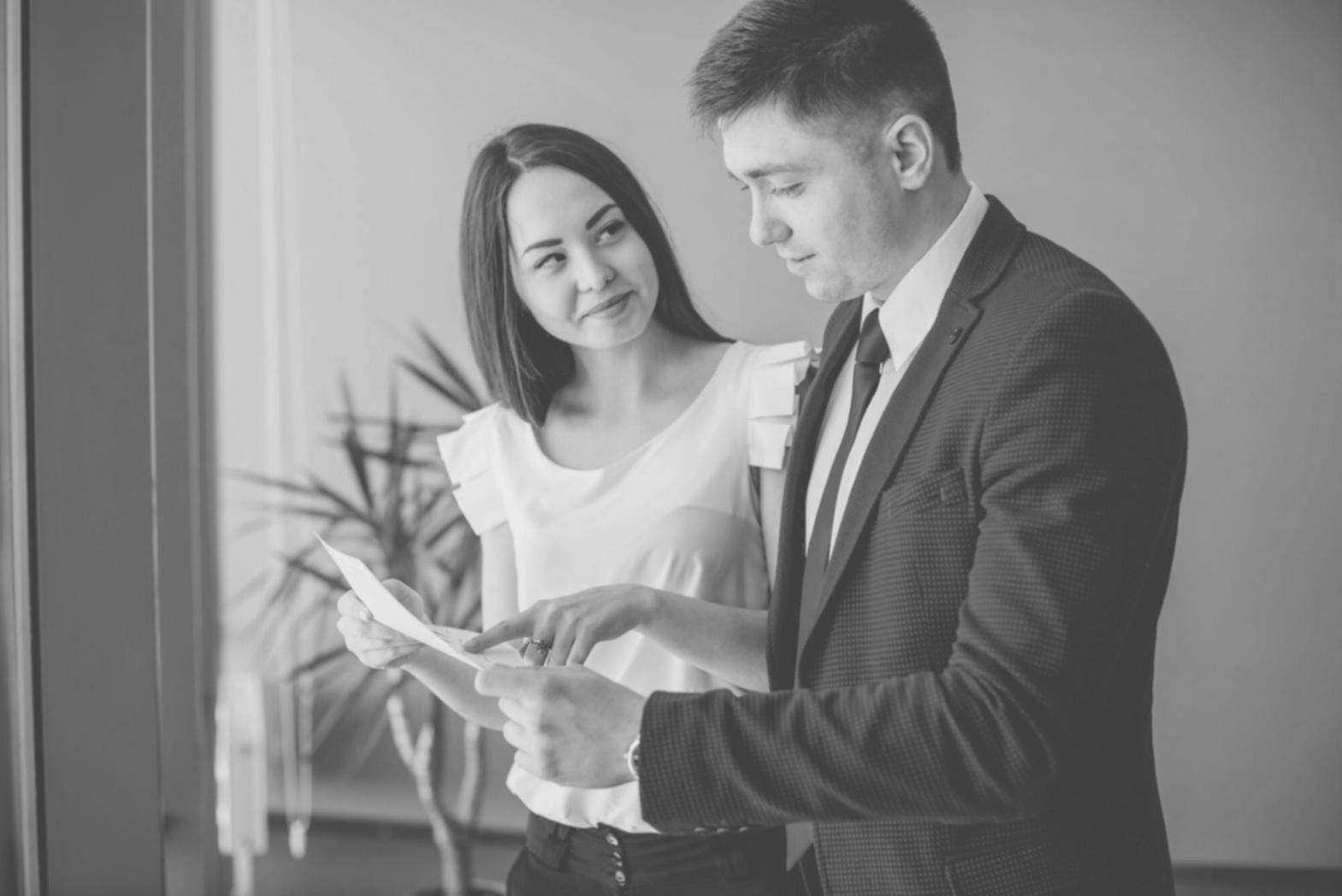 Group of students collaborating on financial analysis project in modern learning space